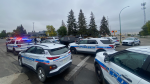 Multiple Regina Police Service cruisers are seen outside F.W. Johnson Collegiate on Sept. 23. (Kayleen Sawatzky/CTV News)