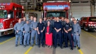 Kathryn Linder, centre, met with the first responders for the first time since she was brutally attacked in her workplace on July 14, 2022.