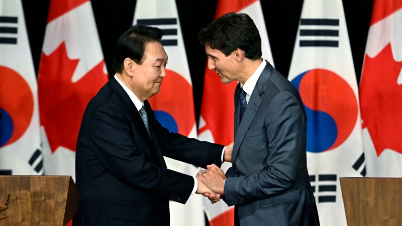 President of South Korea Yoon Suk Yeol and Prime Minister of Canada Justin Trudeau shake hands after participating in a joint news conference during a visit in Ottawa, Friday, Sept. 23, 2022. THE CANADIAN PRESS/Justin Tang