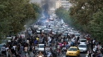 In this Sept. 21, 2022, photo taken by an individual not employed by the Associated Press and obtained by the AP outside Iran, protesters chant slogans during a protest over the death of a woman who was detained by the morality police, in downtown Tehran, Iran. (AP Photo)
