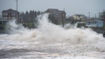 Waves batter the shore in Cow Bay, N.S., on Wednesday, Sept. 23, 2020. Hurricane Teddy has impacted the Atlantic region as a post-tropical storm, bringing rain, wind and high waves. (THE CANADIAN PRESS/Andrew Vaughan)