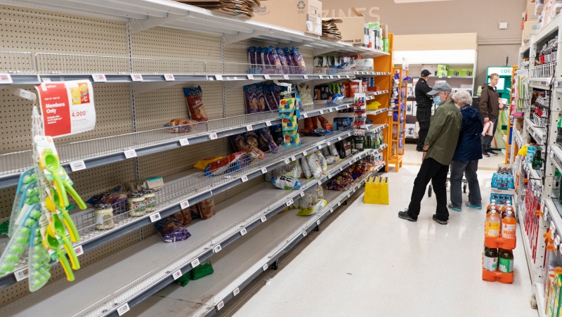 Empty shelves are seen in a grocery store as shoppers stock up on food in advance of Hurricane Fiona making landfall in Halifax on Friday, Sept. 23, 2022. (THE CANADIAN PRESS/Darren Calabrese)