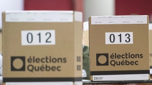 Ballot boxes are shown at a polling station in Montreal, Monday, Oct. 1, 2018, on election day in Quebec. THE CANADIAN PRESS/Graham Hughes