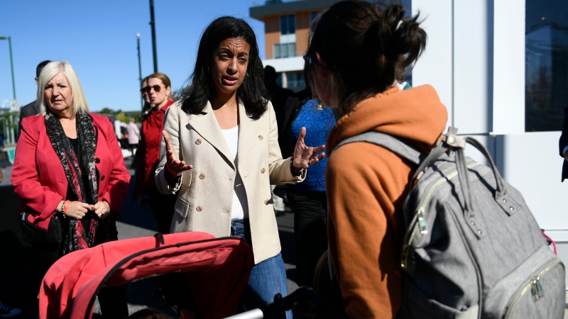 Parti Liberal du Quebec Leader Dominique Anglade speaks to a constituent as she makes a campaign stop at the Joie de Vivre Festival in Gatineau, Que., on Saturday, Sept. 24, 2022. THE CANADIAN PRESS/Justin Tang
