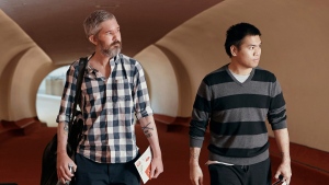 Americans Andy Huynh, right, and Alex Drueke arrive at the TWA Hotel on Friday, Sept. 23, 2022 in New York. The two U.S. military veterans, who disappeared three months ago while fighting Russia with Ukrainian forces, were released this week by Russian-backed separatists as part of a prisoner exchange mediated by Saudi Arabia. (AP Photo/Andres Kudacki)
