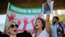 Iranians who live in Brazil protest against the death of Iranian woman Mahsa Amini, who died in Iran while in police custody, in Sao Paulo, Brazil on Sept. 23, 2022. The 22-year-old was arrested by Iran's morality police for allegedly violating its strictly-enforced dress code. (AP Photo/Andre Penner)