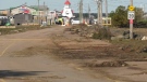 The road to the Pointe-du-Chêne marina and many businesses in town remained closed to the public Sunday due to damage.