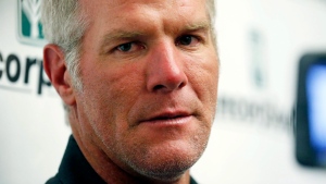 Former NFL quarterback Brett Favre speaks with reporters prior to his induction to the Mississippi Hall of Fame in Jackson, Miss., Aug. 1, 2015. (AP Photo/Rogelio V. Solis)