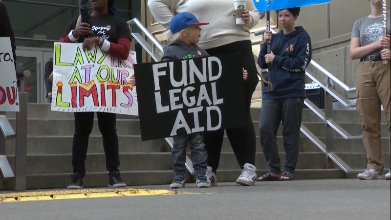 Protesters outside the Calgary Courts Centre calling for changes to Legal Aid funding in Alberta.