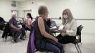 Residents roll up their sleeves for a COVID-19 vaccine at a pop-up clinic in Stayner, Ont., on Mon., Sept. 26, 2022 (CTV News/Mike Arsalides)