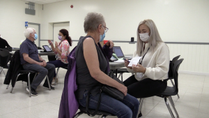 Residents roll up their sleeves for a COVID-19 vaccine at a pop-up clinic in Stayner, Ont., on Mon., Sept. 26, 2022 (CTV News/Mike Arsalides)  