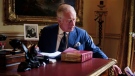 In this photo Sept. 11, 2022, taken Britain's King Charles III carries out official government duties from his red box in the Eighteenth Century Room at Buckingham Palace, London. (Victoria Jones/PA via AP)