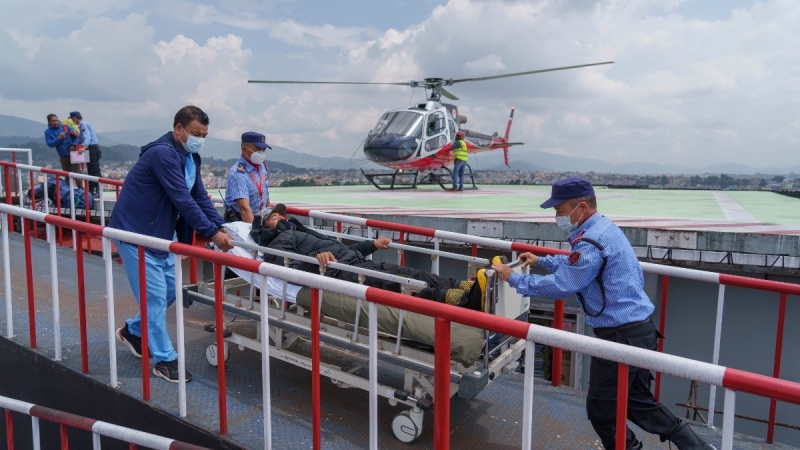 A Nepali sherpa guide who survived an avalanche on Mount Manaslu is taken for treatment at a hospital in Kathmandu, Nepal, on Sept. 27, 2022. (Niranjan Shrestha / AP)