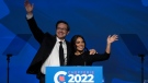 Newly elected Conservative leader Pierre Poilievre and his wife Anaida wave as they take the stage after winning the leadership, Saturday, September 10, 2022 in Ottawa. (The Canadian Press/Adrian Wyld)