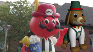 A rendering of the new puppy float superimposed over a picture of an Onkel Hans float from a previous Oktoberfest Thanksgiving Day Parade. (CTV Kitchener)