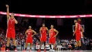 Canada's Dwight Powell (7) takes a free throw as teammates look on during second half FIBA international men's World Cup basketball qualifying action against Dominican Republic, in Hamilton, Ont., Friday, July 1, 2022. THE CANADIAN PRESS/Cole Burston