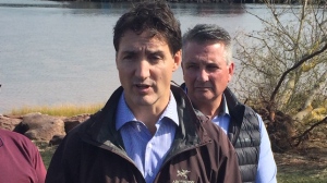 Prime Minister Justin Trudeau is joined by Minister of Veterans Affairs and Associate Minister of National Defence Lawrence MacAulay (left) and Liberal MP Heath MacDonald as he visits Stanley Bridge, P.E.I., Tuesday, September 27, 2022 to view damage caused by post-tropical storm Fiona. THE CANADIAN PRESS/Brian McInnis