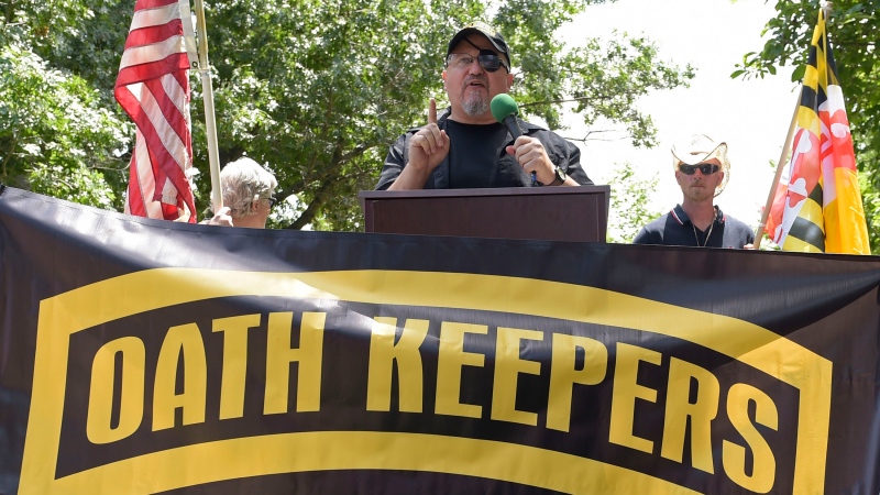 Stewart Rhodes, founder of the Oath Keepers, center, speaks during a rally outside the White House in Washington, June 25, 2017. (AP Photo/Susan Walsh, File)