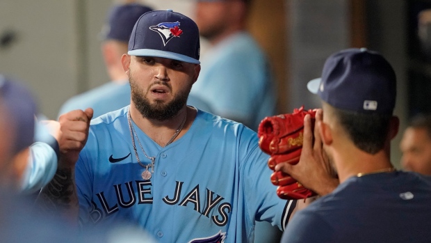 Toronto Blue Jays starter Alek Manoah is greeted in the dugout on Saturday, July 9, 2022. (AP Photo/Ted S. Warren)