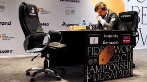 Magnus Carlsen of Norway competes during the FIDE World Championship at Dubai Expo 2020 in Dubai, United Arab Emirates, Friday, Dec. 10, 2021. (AP Photo/Jon Gambrell) 