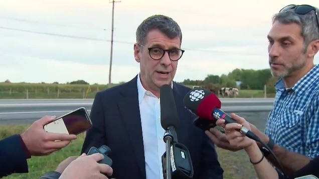 Quebec Conservative Party Leader Eric Duhaime responds to questions from the media on Tuesday, Sept. 27, 2022, about his past remarks about building a wall between the U.S. and Canadian border. (CTV News)