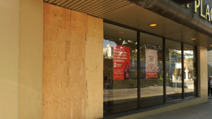 A boarded up store window is seen at Denman Place Mall in Vancouver's West End on Sept. 27, 2022. 