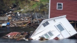 Buildings sit in the water along the shore following hurricane Fiona in Rose Blanche-Harbour Le Cou, Newfoundland on Tuesday September 27, 2022. THE CANADIAN PRESS/Frank Gunn