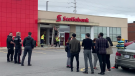 A driver crashed into this Scotiabank on Strandherd Drive on Sept. 28, 2022. Two people suffered minor injuries. (Photo: CTV viewer)