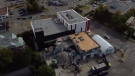 The demolished fire tower is pictured behind the new No. 1 Fire Station in Nanaimo, B.C. (CTV News)