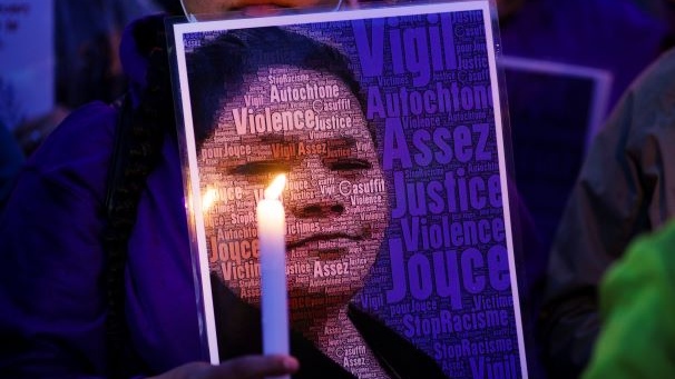 A picture of Joyce Echaquan is seen during a vigil in front of the hospital where she died in Joliette, Que. on Monday, September 28, 2020. A nurse has been fired after Echaquan, an Indigenous woman, who was dying Monday night in hospital was subjected to degrading remarks. THE CANADIAN PRESS/Paul Chiasson