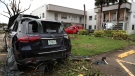 Cars damaged from an apparent overnight tornado spawned from Hurricane Ian at Kings Point 55+ community in Delray Beach, Fla., on Wednesday, Sept. 28, 2022.  (Carline Jean/South Florida Sun-Sentinel via AP)