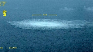 In this picture provided by Swedish Coast Guard, the gas leak in the Baltic Sea from Nord Stream photographed from the Coast Guard's aircraft on Wednesday, Sept. 27, 2022. (Swedish Coast Guard via AP)
