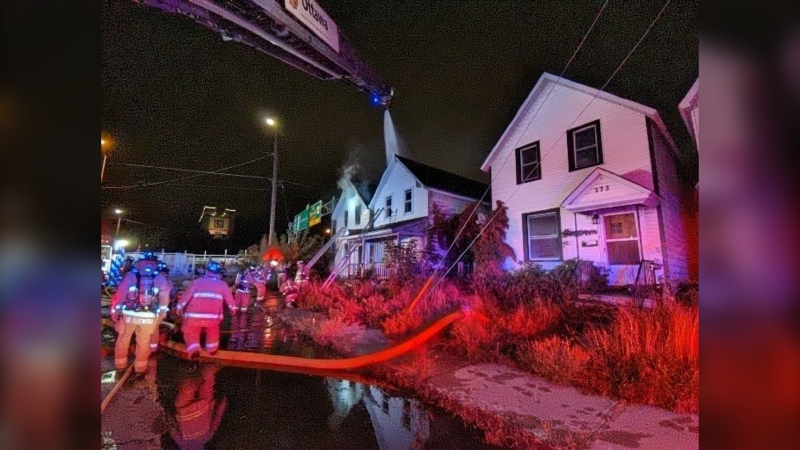 An Ottawa firefighter was injured fighting a fire in two neighbouring homes west of downtown Wednesday night. (Ottawa Fire Services)
