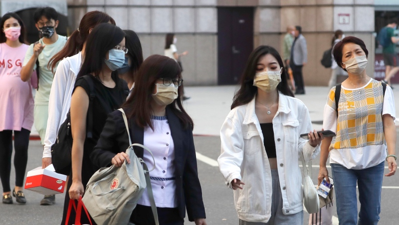 People wear face masks to protect against the spread of the coronavirus in Taipei, Taiwan on Aug. 31, 2022. Taiwan is considering an end to its quarantine requirement for all arrivals in mid-October, the Central Epidemic Command Center said Thursday, Sept. 22, 2022. (AP Photo/Chiang Ying-ying, File)