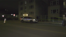 Ottawa police at an apartment building on Deschamps Avenue in Vanier Wednesday night, where human remains were uncovered. (Shaun Vardon/CTV News Ottawa)