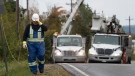 Power crews work to fix power lines near Lower Barneys River in Pictou County, N.S. on Wednesday, September 28, 2022 following significant damage brought by post tropical storm Fiona. THE CANADIAN PRESS/Darren Calabrese