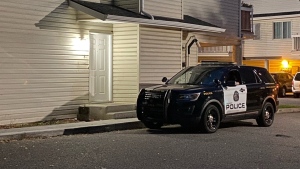  A Calgary Police Service unit near a home on Bannister Manor S.E. in Midnapore early Thursday morning during the investigation into the death of a child. 