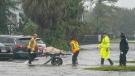 Authorities transport a person out of the Avante nursing home in the aftermath of Hurricane Ian, Thursday, Sept. 29, 2022, in Orlando, Fla. (AP Photo/John Raoux)