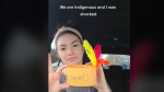 In a TikTok video posted Thursday, a gob-smacked Samantha Sinclair holds up an orange “headdress” made out of construction paper and feathers. Photo: @sandkcollective/Tiktok