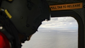 In this photo provided by the Armed Forces of Denmark, the crew in a helicopter of the Armed Forces monitors the gas leak, in the Baltic Sea, Thursday, Sept. 29, 2022. (Rune Dyrholm/Armed Forces of Denmark via AP)