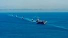 In this photo provided by the South Korea Defense Ministry, the USS Ronald Reagan aircraft carrier, second from right, participates in a joint anti-submarine drill among South Korea, the United States and Japan in waters off South Korea's eastern coast in South Korea, Friday, Sept. 30, 2022. South Korea, U.S. and Japanese warships launched their first trilateral anti-submarine drills in five years on Friday, after North Korea renewed missile tests this week in an apparent response to bilateral training by South Korean and U.S. forces. (South Korea Defense Ministry via AP)
