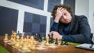 Hans Niemann, pictured playing chess in St. Louis on September 11, has been accused of cheating by five-time world champion Magnus Carlsen. (Lennart Ootes/Grand Chess Tour/CNN)