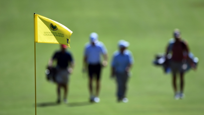 A group walks a fairway during the pro-am at the Sanderson Farms Championship golf tournament at the Country Club of Jackson, Wednesday, Sept. 28, 2022, in Jackson, Miss. (Barbara Gauntt/The Clarion-Ledger via AP)