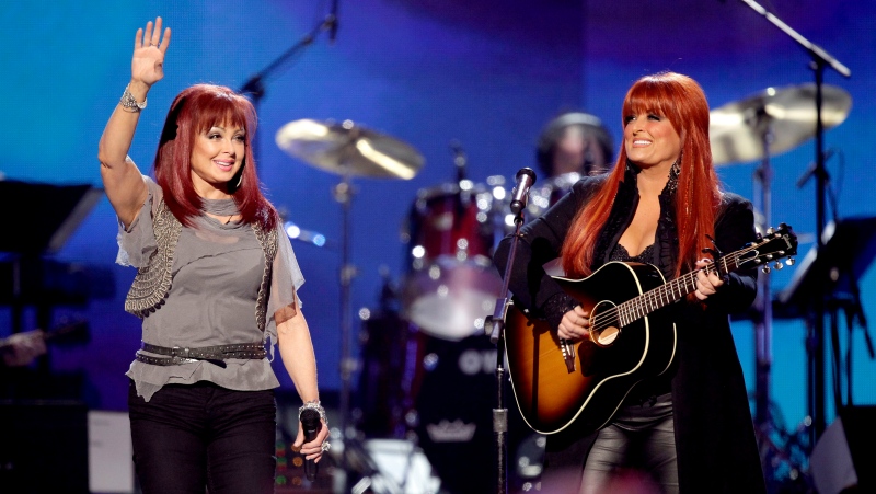 Naomi Judd, left, and Wynonna Judd, of The Judds, perform at the 'Girls' Night Out: Superstar Women of Country,' in Las Vegas, April 4, 2011. (AP Photo/Julie Jacobson, File)