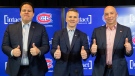 New Montreal Canadiens interim head coach Martin St. Louis, centre, Canadiens executive vice-president of hockey operations Jeff Gorton, left, and General Manager Kent Hughes in Brossard, Que., Thursday, Feb. 10, 2022. THE CANADIAN PRESS/Graham Hughes
