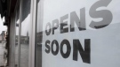 FILE - A sign announces a store will open soon Thursday April 30, 2020 in Ottawa. ADRIAN WYLD / THE CANADIAN PRESS