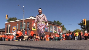 Jingle Dress dancer Mason Sands, 23, dances during a remembrance ceremony in the intersection of Colborne St. and Horton St. in London, Ont. on Sept. 30, 2022. (Source: Brent Lale/CTV London)