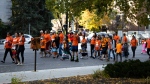 Hundreds of residents in orange shirts filled Regina's downtown during an honour walk on the morning of Sept. 30, 2022. (David Prisciak/CTV News)