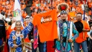 Sherry Starr and Wab Kinew lead the grand entrance at the second annual Orange Shirt Day Survivors Walk and Pow Wow on National Day for Truth and Reconciliation in Winnipeg, Friday, September 30, 2022. THE CANADIAN PRESS/John Woods