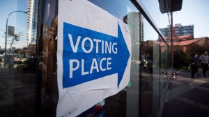 A sign directing voters to a polling station in Vancouver, B.C., is seen on Oct. 20, 2018. (THE CANADIAN PRESS/Darryl Dyck)